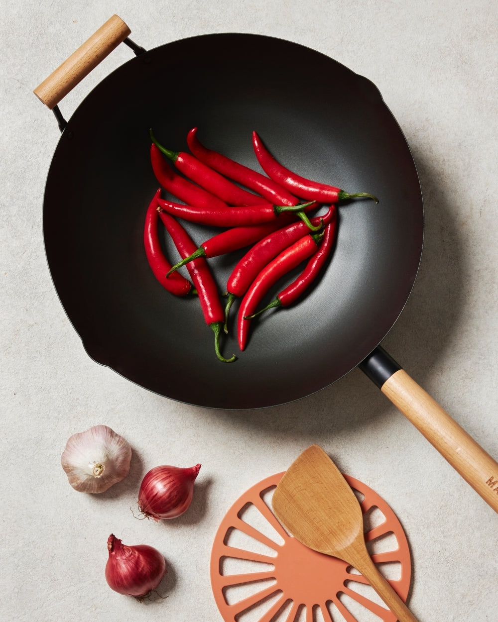 So many wok choices. But which material makes for the best wok?